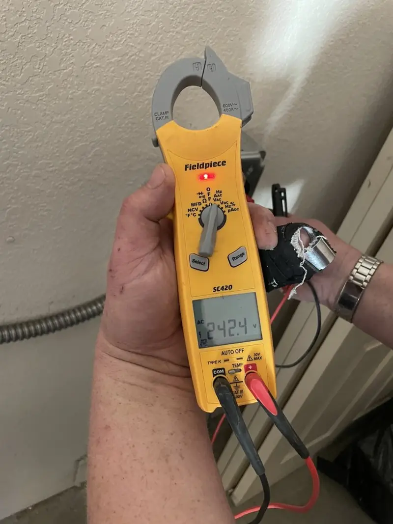 Voltage testing with clamp meter during Generator Installation in Newington